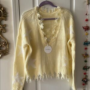 Storia Pale Yellow V-Neck Fringe Sweater with White Star Details